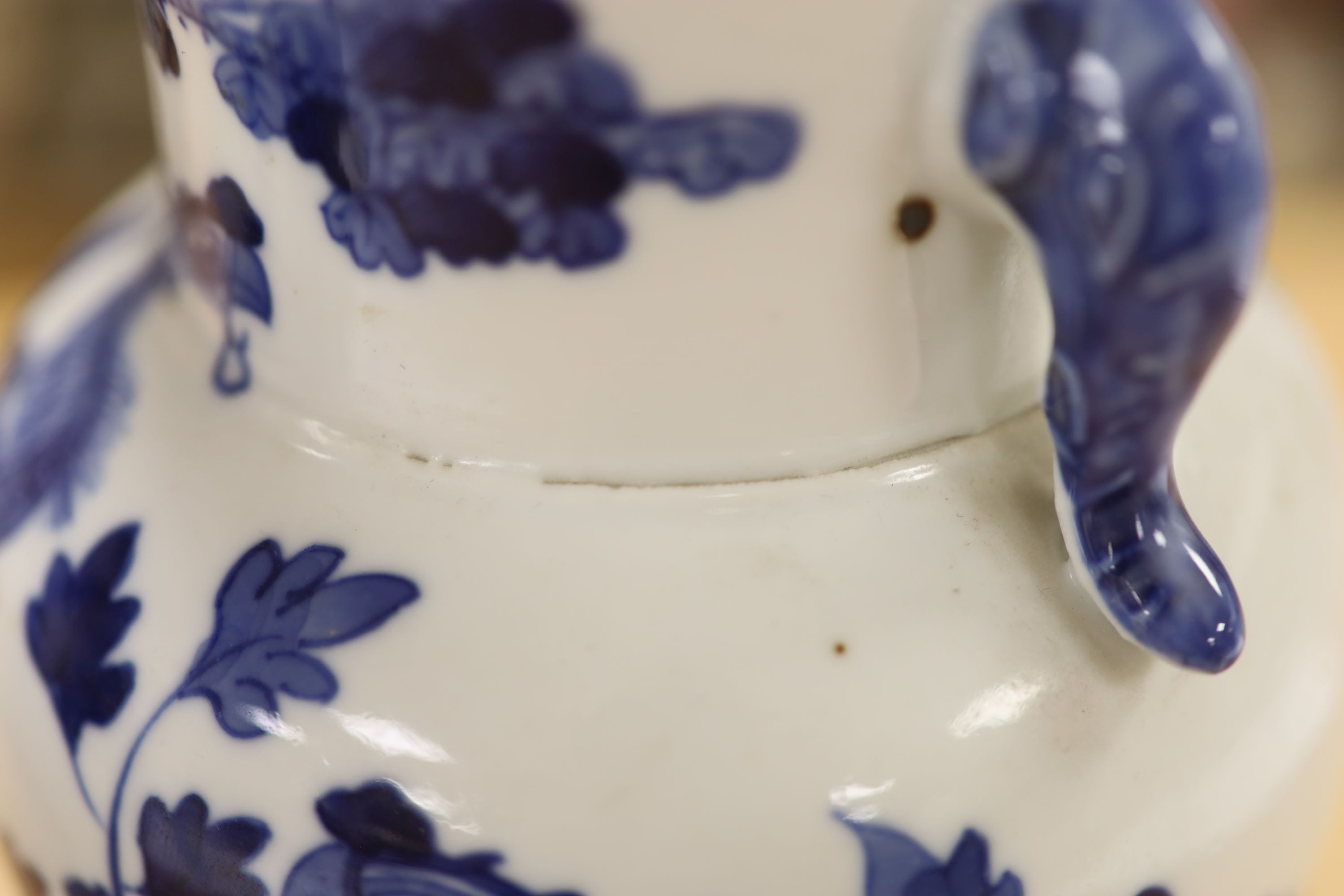 A pair of Chinese blue and white 'phoenix' vases, Kangxi marks but late 19th century, height 20cm (a.f.)